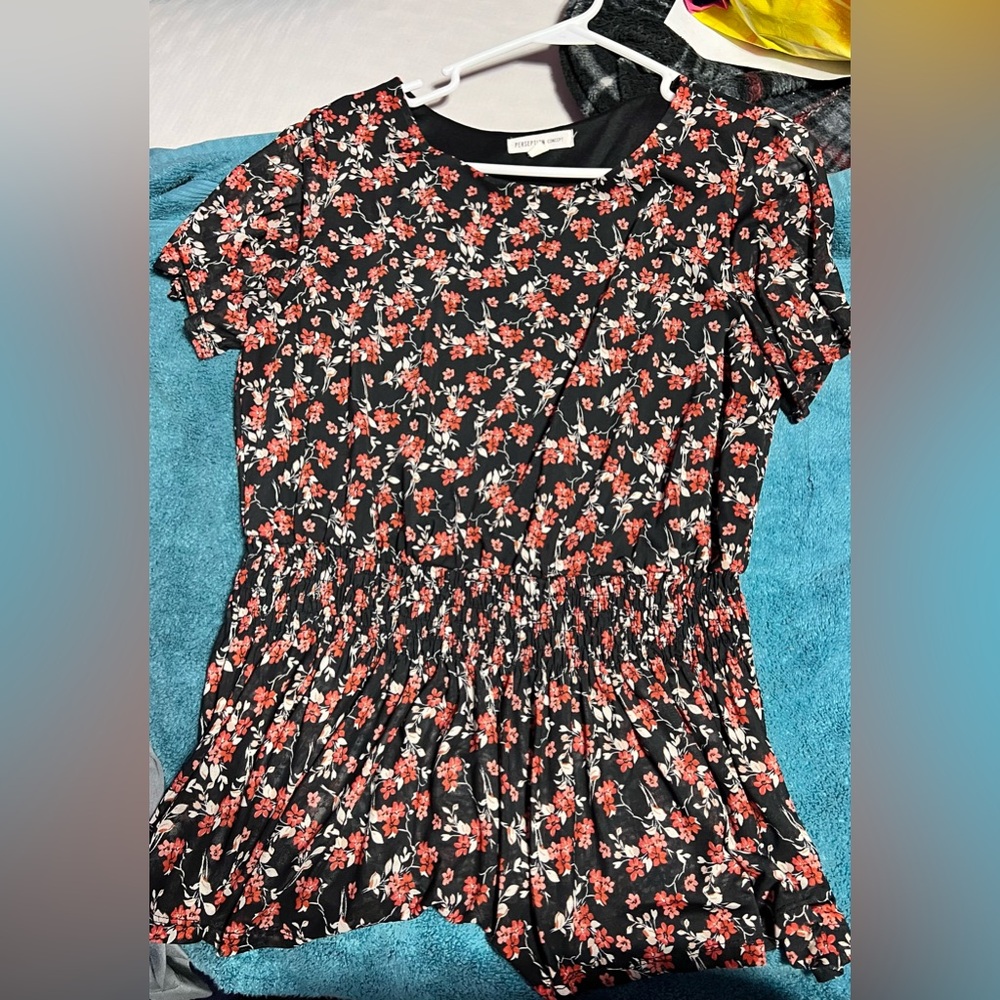Size Large blouse. In excellent condition. Not faded or anything. No scammers
